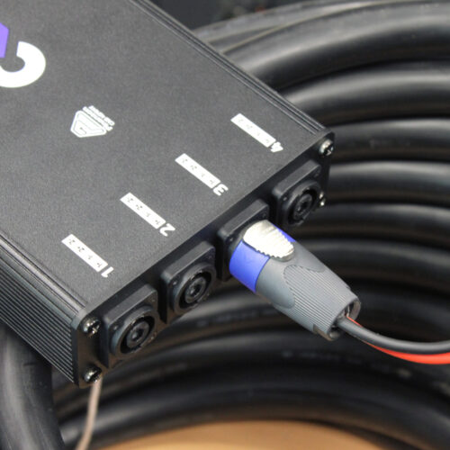 Speaker stage box with 4 numbered speakON on its coiled multicore